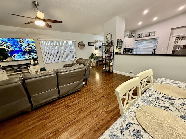 8421 SW 41st Ct, Davie, FL 33328 - living area featuring a ceiling fan, dark wood-style flooring, and vaulted ceiling