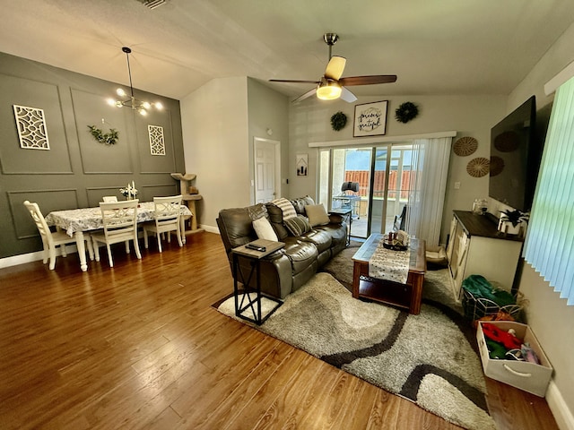 8421 SW 41st Ct, Davie, FL 33328 - living room with vaulted ceiling, a ceiling fan, wood finished floors, and a chandelier