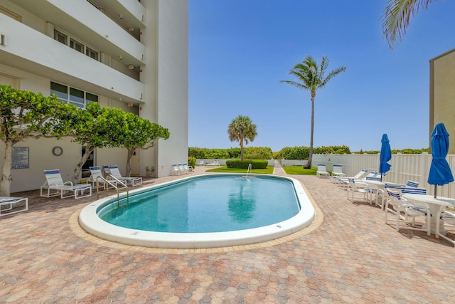 3640 N Ocean Dr Unit 427, Singer Island, FL 33404 - community pool featuring a patio