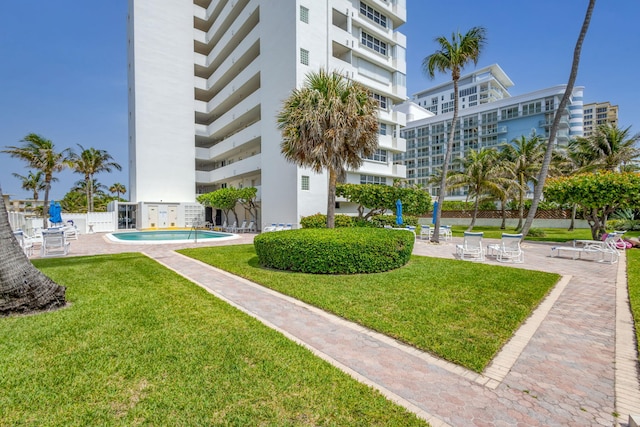 3640 N Ocean Dr Unit 427, Singer Island, FL 33404 - surrounding community featuring a patio and a pool