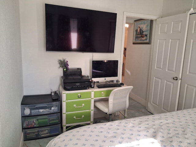 2506 Oleander Blvd, Fort Pierce, FL 34982 - bedroom featuring baseboards, a desk, and marble look tile flooring
