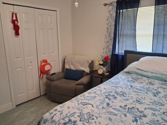 2506 Oleander Blvd, Fort Pierce, FL 34982 - bedroom with marble look tiles and a closet