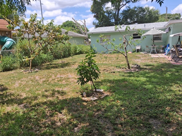 2506 Oleander Blvd, Fort Pierce, FL 34982 - view of grassy yard featuring a patio area