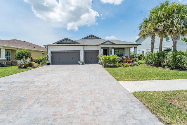 19404 Broad Shore Walk, Loxahatchee, FL 33470 - ranch-style home featuring decorative driveway, a garage, a front lawn, and stucco siding