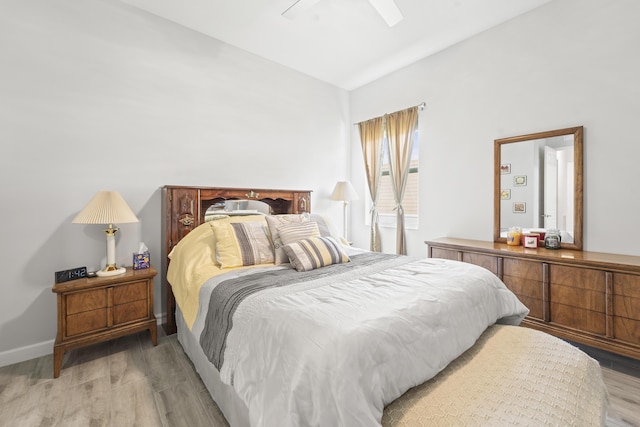 19404 Broad Shore Walk, Loxahatchee, FL 33470 - bedroom with light wood-style flooring, vaulted ceiling, and ceiling fan