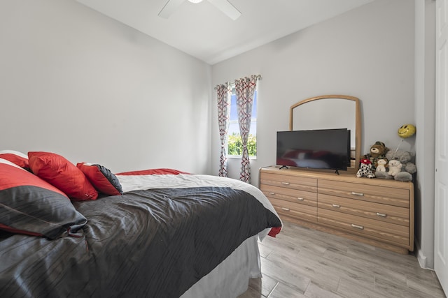 19404 Broad Shore Walk, Loxahatchee, FL 33470 - bedroom featuring lofted ceiling, light wood-style flooring, and a ceiling fan
