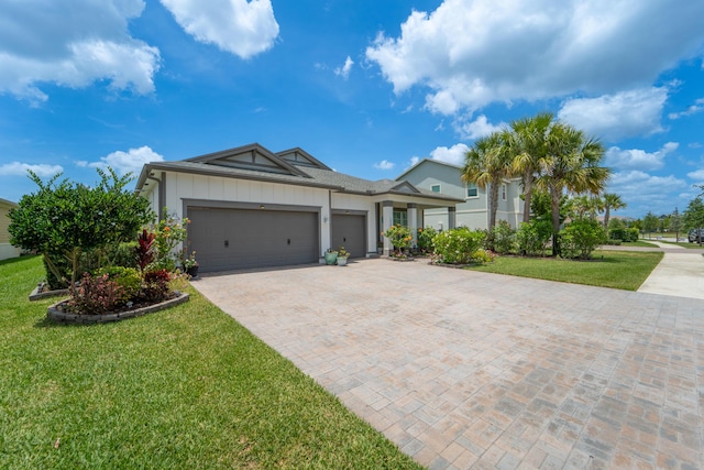 19404 Broad Shore Walk, Loxahatchee, FL 33470 - ranch-style home with a garage, decorative driveway, and a front lawn