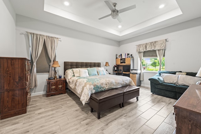 19404 Broad Shore Walk, Loxahatchee, FL 33470 - bedroom featuring a tray ceiling, recessed lighting, wood finished floors, and ceiling fan