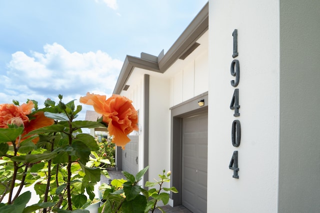 19404 Broad Shore Walk, Loxahatchee, FL 33470 - view of exterior entry featuring a garage