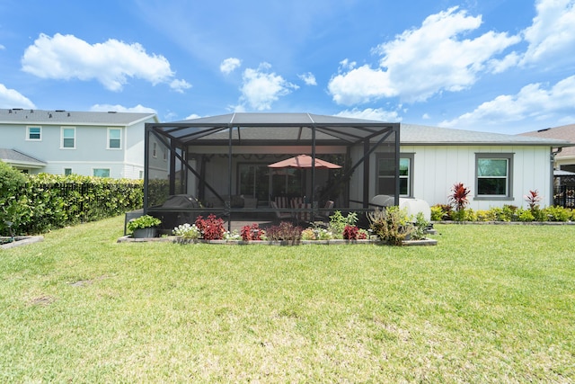 19404 Broad Shore Walk, Loxahatchee, FL 33470 - rear view of house featuring a lawn, board and batten siding, and a lanai