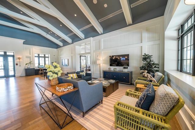 19404 Broad Shore Walk, Loxahatchee, FL 33470 - living area featuring a decorative wall, beamed ceiling, wood finished floors, french doors, and high vaulted ceiling