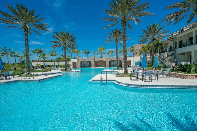 19404 Broad Shore Walk, Loxahatchee, FL 33470 - community pool with a patio and stairway