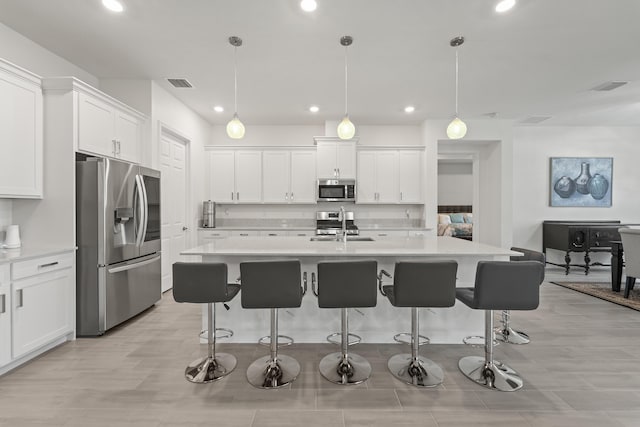 19404 Broad Shore Walk, Loxahatchee, FL 33470 - kitchen featuring appliances with stainless steel finishes, a sink, recessed lighting, and light countertops
