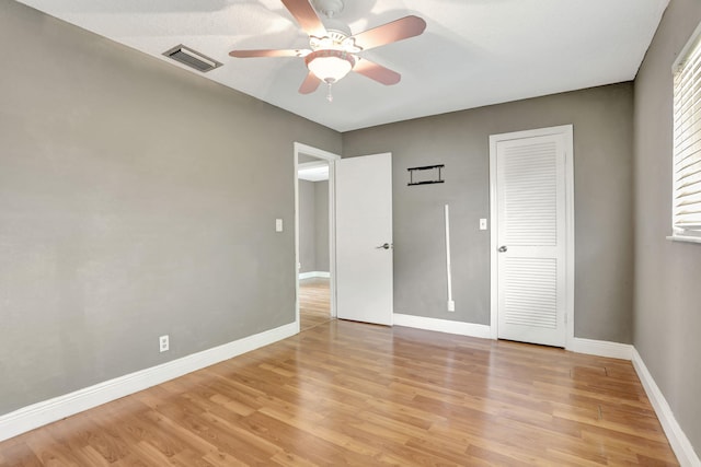 9062 NW 20th Mnr, Coral Springs, FL 33071 - unfurnished bedroom with light wood-type flooring, baseboards, and ceiling fan