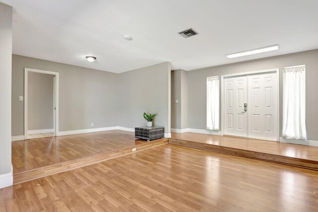 9062 NW 20th Mnr, Coral Springs, FL 33071 - foyer entrance with light wood finished floors and baseboards
