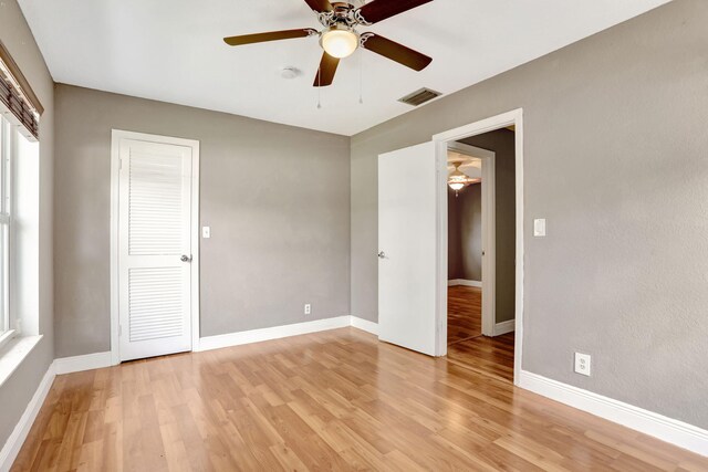 9062 NW 20th Mnr, Coral Springs, FL 33071 - unfurnished bedroom featuring light wood-style flooring, baseboards, and multiple windows
