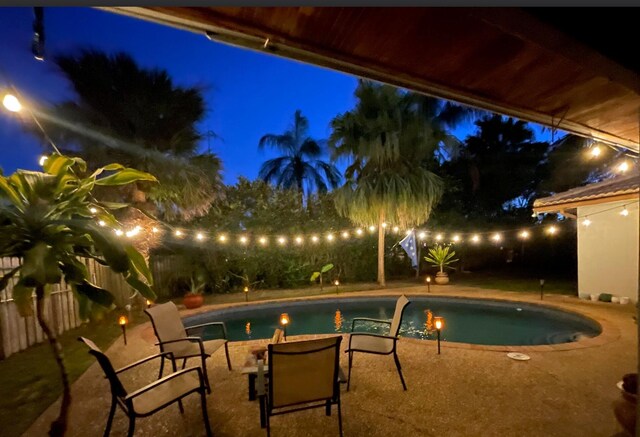 9062 NW 20th Mnr, Coral Springs, FL 33071 - pool at twilight featuring a fenced backyard