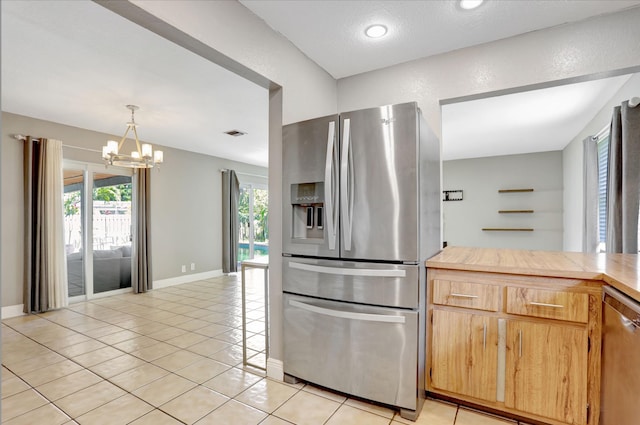 9062 NW 20th Mnr, Coral Springs, FL 33071 - kitchen featuring appliances with stainless steel finishes, a chandelier, light tile patterned floors, light countertops, and baseboards