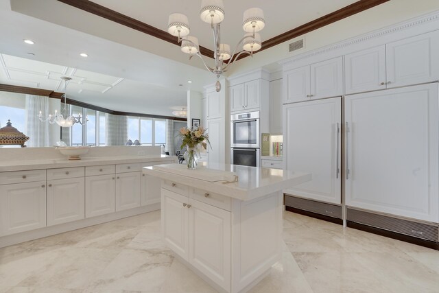 5050 N Ocean Dr Unit 1701, Singer Island, FL 33404 - kitchen featuring a chandelier, double oven, ornamental molding, light marble finish floors, and built in fridge