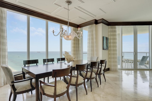 5050 N Ocean Dr Unit 1701, Singer Island, FL 33404 - dining area with crown molding, a chandelier, a water view, expansive windows, and baseboards