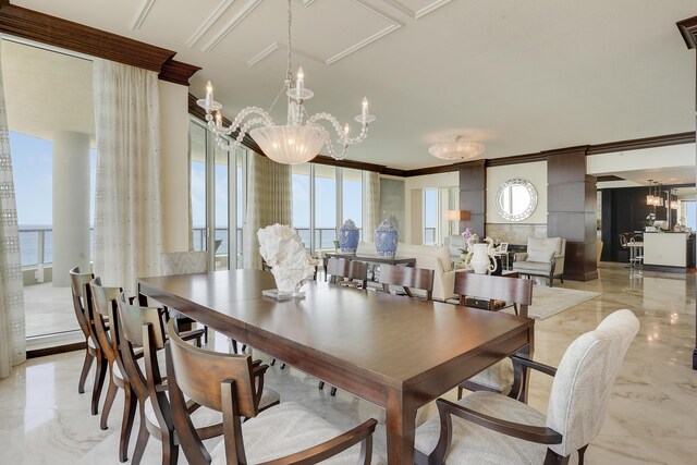 5050 N Ocean Dr Unit 1701, Singer Island, FL 33404 - dining space featuring ornamental molding, plenty of natural light, a chandelier, and light marble finish floors