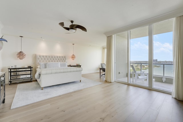 5050 N Ocean Dr Unit 1701, Singer Island, FL 33404 - bedroom with light wood-style floors, access to exterior, expansive windows, and a ceiling fan