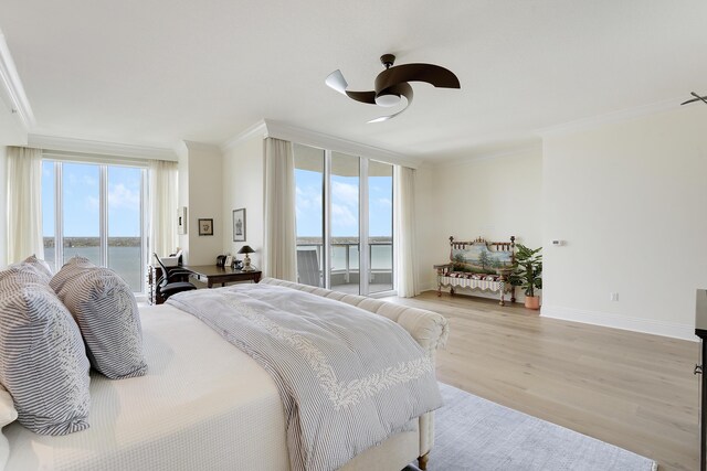 5050 N Ocean Dr Unit 1701, Singer Island, FL 33404 - bedroom featuring ornamental molding, access to outside, a water view, light wood-style flooring, and ceiling fan