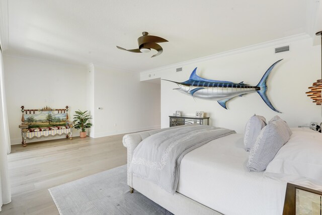 5050 N Ocean Dr Unit 1701, Singer Island, FL 33404 - bedroom with ornamental molding, wood finished floors, ceiling fan, and baseboards