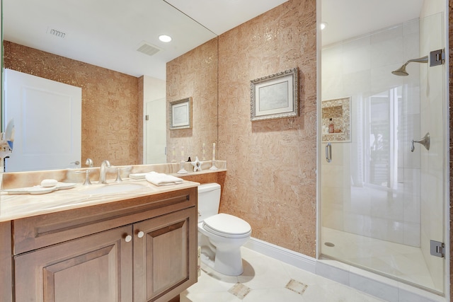 5050 N Ocean Dr Unit 1701, Singer Island, FL 33404 - bathroom featuring a stall shower, vanity, toilet, and tile patterned floors