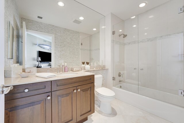 5050 N Ocean Dr Unit 1701, Singer Island, FL 33404 - full bath featuring vanity, tile patterned flooring, shower / bathtub combination, toilet, and ensuite bathroom