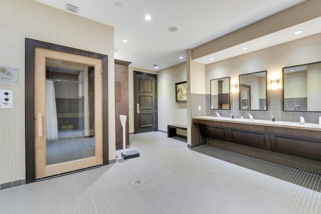 5050 N Ocean Dr Unit 1701, Singer Island, FL 33404 - full bathroom featuring double vanity, baseboards, tasteful backsplash, and recessed lighting
