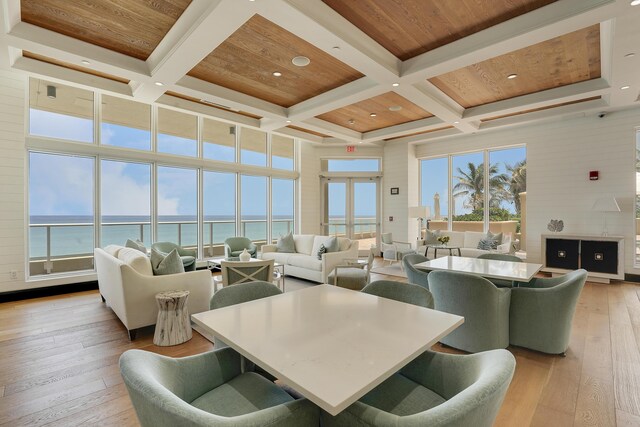 5050 N Ocean Dr Unit 1701, Singer Island, FL 33404 - living area with coffered ceiling, a water view, light wood-style flooring, beam ceiling, and recessed lighting