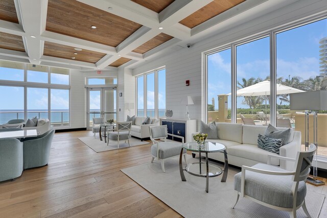 5050 N Ocean Dr Unit 1701, Singer Island, FL 33404 - living room with coffered ceiling, beamed ceiling, light wood-style floors, recessed lighting, and a towering ceiling