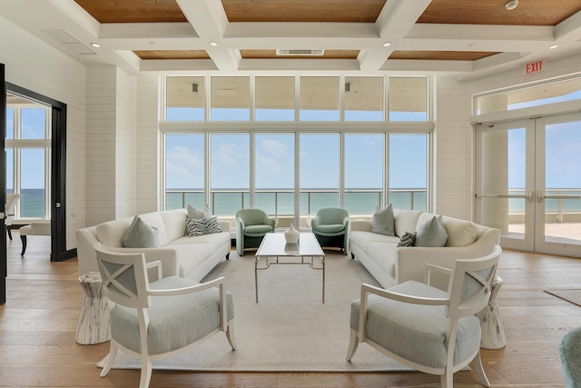 5050 N Ocean Dr Unit 1701, Singer Island, FL 33404 - living area featuring coffered ceiling, a high ceiling, french doors, a water view, and beamed ceiling