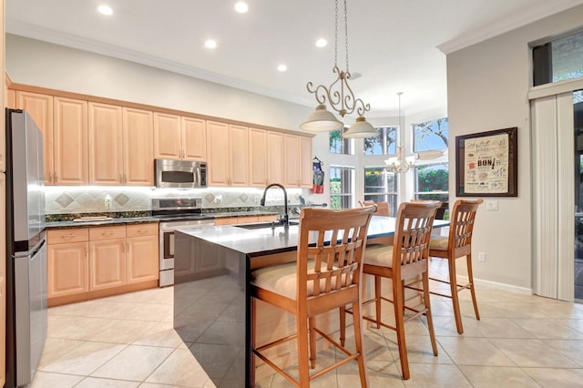 8127 Playa Del Sur Blvd, Lake Worth, FL 33467 - kitchen with appliances with stainless steel finishes, a sink, ornamental molding, light brown cabinets, and light tile patterned flooring