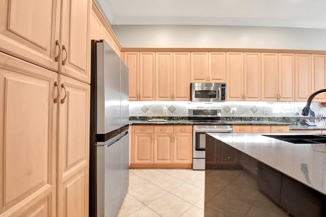 8127 Playa Del Sur Blvd, Lake Worth, FL 33467 - kitchen featuring appliances with stainless steel finishes, light brown cabinets, a sink, light tile patterned floors, and dark stone counters