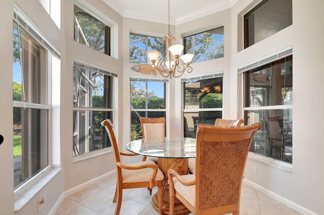 8127 Playa Del Sur Blvd, Lake Worth, FL 33467 - dining room featuring tile patterned flooring, crown molding, a chandelier, baseboards, and a high ceiling