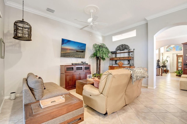 8127 Playa Del Sur Blvd, Lake Worth, FL 33467 - living area with arched walkways, light tile patterned floors, a ceiling fan, crown molding, and baseboards
