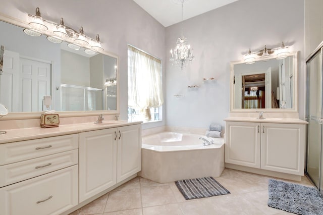 8127 Playa Del Sur Blvd, Lake Worth, FL 33467 - bathroom featuring a stall shower, a garden tub, two vanities, and a chandelier