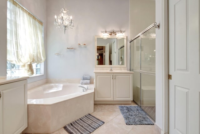 8127 Playa Del Sur Blvd, Lake Worth, FL 33467 - bathroom with a garden tub, vanity, a stall shower, and a chandelier
