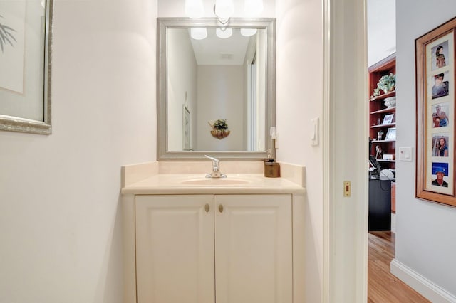 8127 Playa Del Sur Blvd, Lake Worth, FL 33467 - bathroom with vanity, wood finished floors, and baseboards