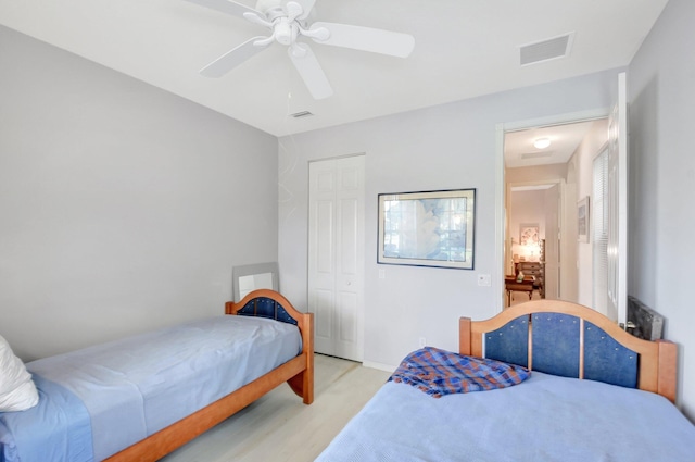 8127 Playa Del Sur Blvd, Lake Worth, FL 33467 - bedroom featuring a closet, ceiling fan, and light wood-type flooring
