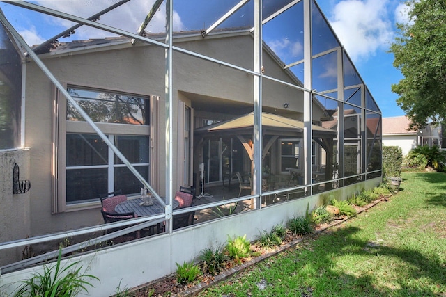 8127 Playa Del Sur Blvd, Lake Worth, FL 33467 - back of house featuring a yard, a lanai, and stucco siding