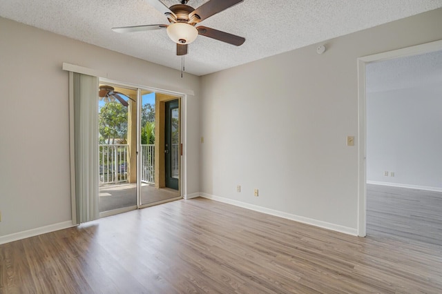 6315 La Costa Dr Unit G, Boca Raton, FL 33433 - spare room with a ceiling fan, a textured ceiling, wood finished floors, baseboards, and a smoke detector