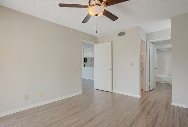 6315 La Costa Dr Unit G, Boca Raton, FL 33433 - spare room featuring light wood finished floors, ceiling fan, baseboards, and a textured ceiling