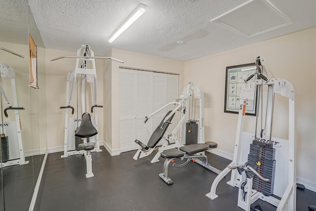 6315 La Costa Dr Unit G, Boca Raton, FL 33433 - workout room with a textured ceiling and baseboards