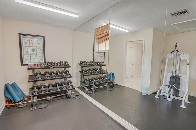 6315 La Costa Dr Unit G, Boca Raton, FL 33433 - gym featuring a textured ceiling and baseboards