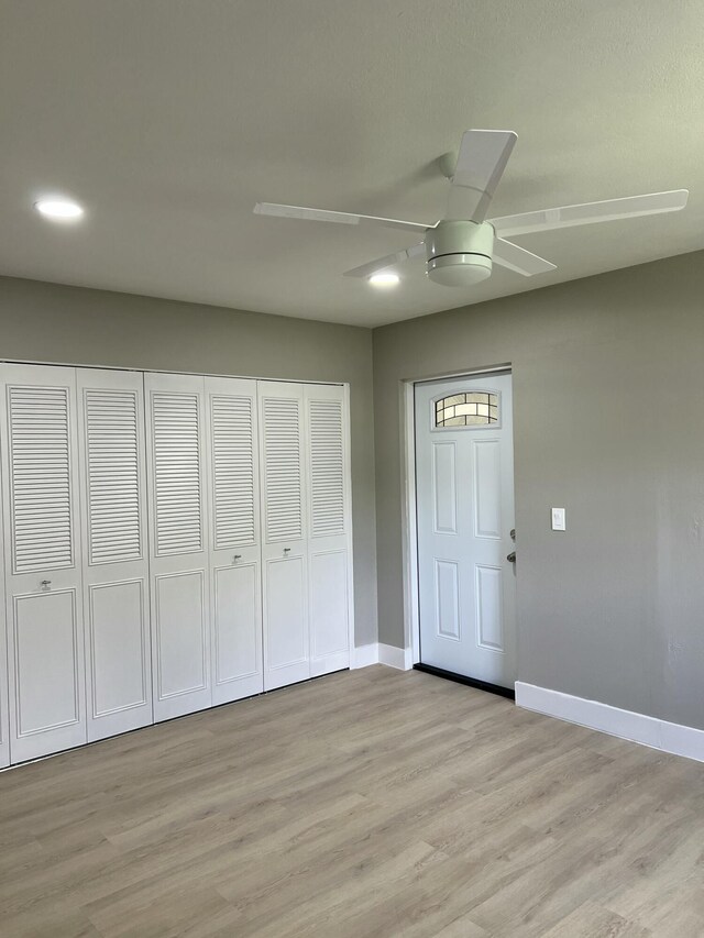 267 Flanders F, Delray Beach, FL 33484 - entrance foyer with ceiling fan and light wood-style floors