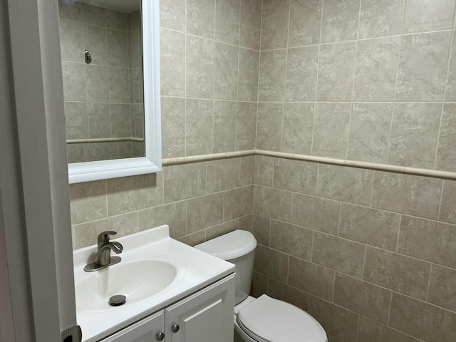 267 Flanders F, Delray Beach, FL 33484 - bathroom featuring vanity and tile walls