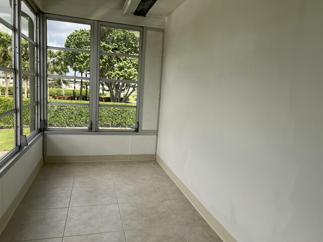 267 Flanders F, Delray Beach, FL 33484 - unfurnished sunroom featuring plenty of natural light